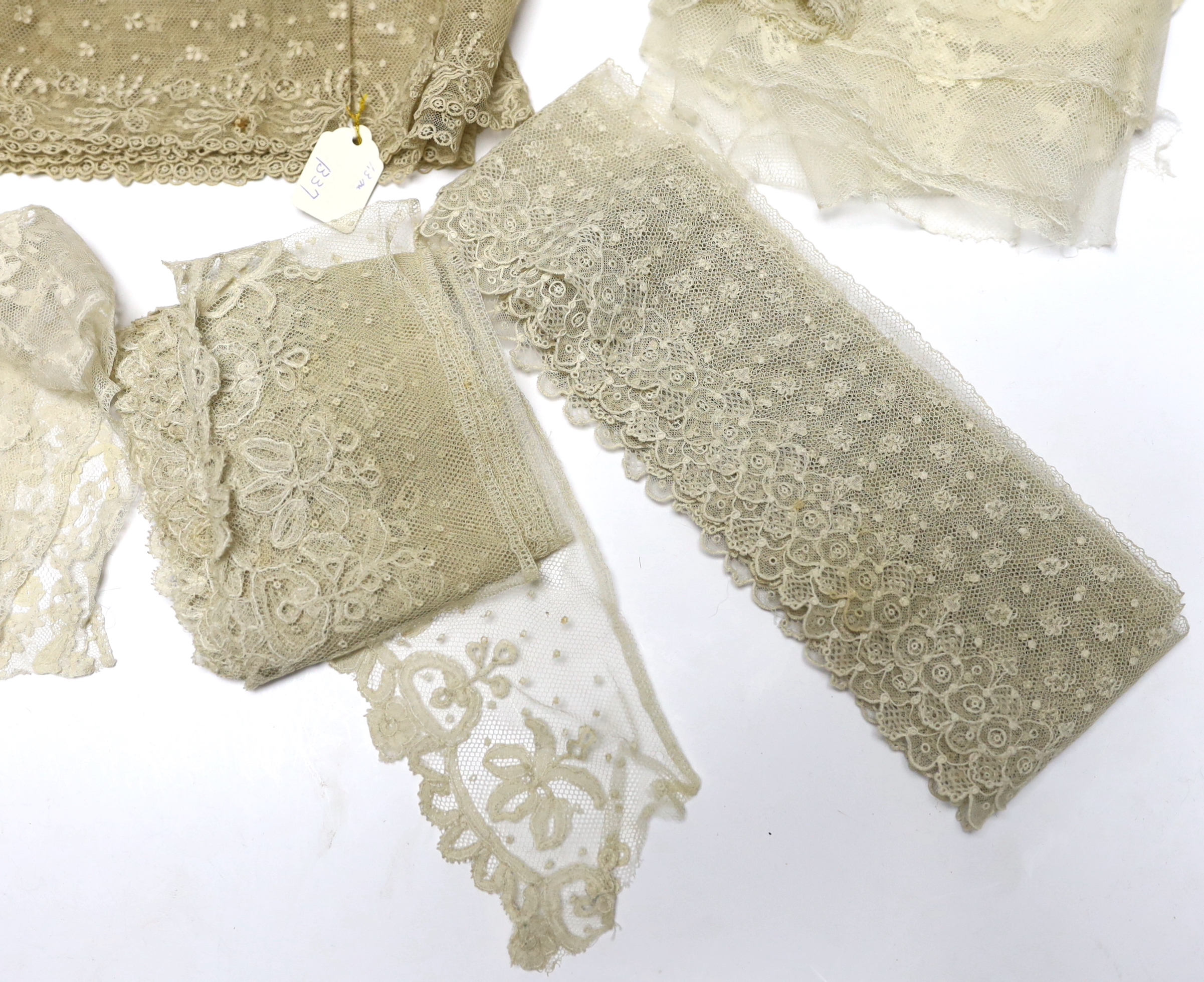 A collection of mostly 19th century French and English needle and bobbin lace trimmings, white worked sleeves, a black silk stole and black lace trimmings etc
